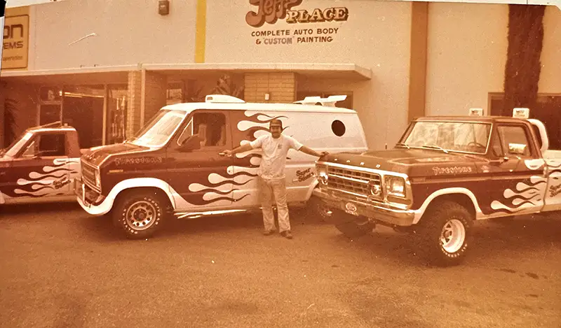 Old photo with Von Dago and some vehicles outside of Jeff's Place