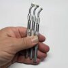Set of Pounce Wheels in hand showing size