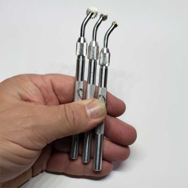 Set of Pounce Wheels in hand showing size